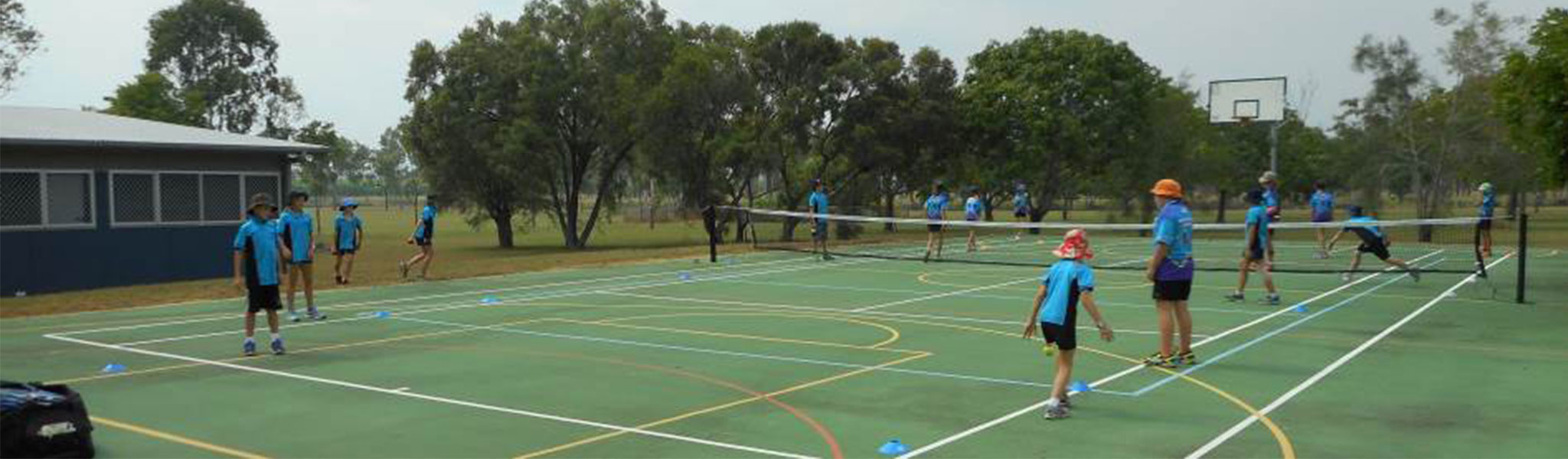 Students playing on a tennis court
